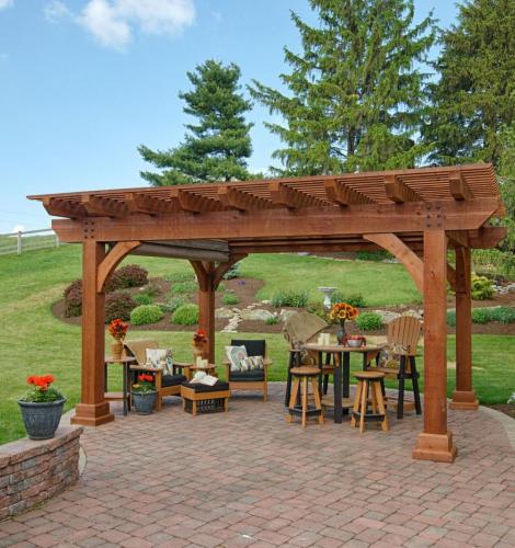 Wood Kingston Pergola outside on back patio with table and chairs underneath.