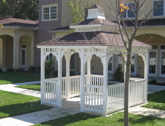 White vinyl rectangle gazebo with a cupola