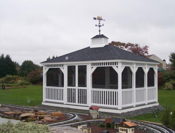 White vinyl rectangle gazebo with weather vane