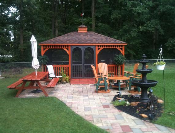 Brown wood rectangle gazebo with weather vane 