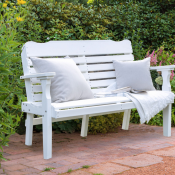 White bench with throw pillows