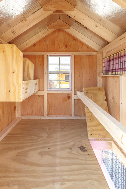 A-Frame chicken coop wooden interior.